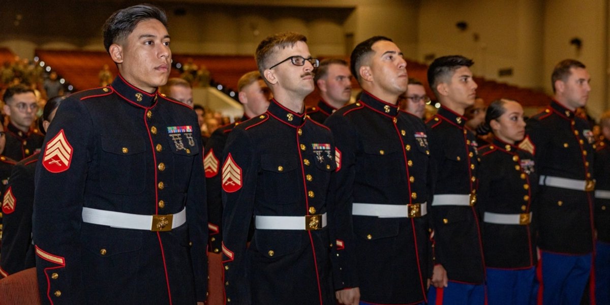 U.S. Marines with Marine Corps Recruiting and Retention School stand at attention for the national anthem during a graduation ceremony at Marine Corps Recruit Depot San Diego, California, Oct. 7, 2025.