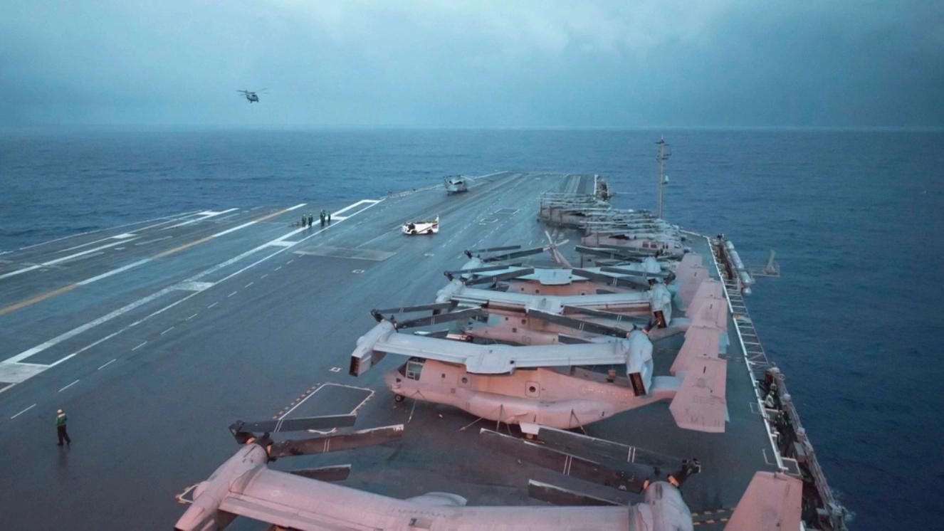 Osprey aircraft on USS Washington deck at sea during operations