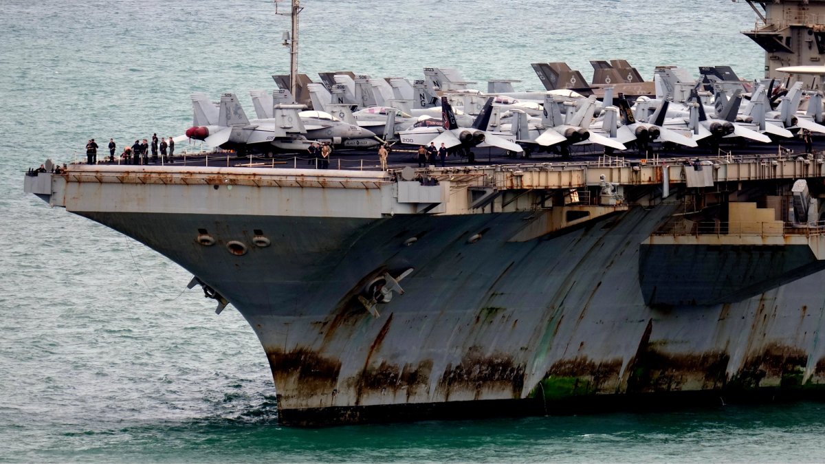 USS Lincoln, deeply in need of maintenance, comes into port Closeup.