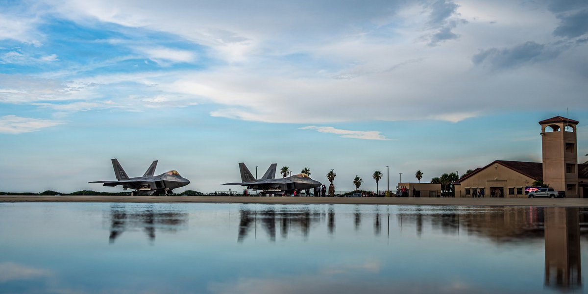 F-22 Raptors sitting outside a hanger at Patrick Space Force Base.
