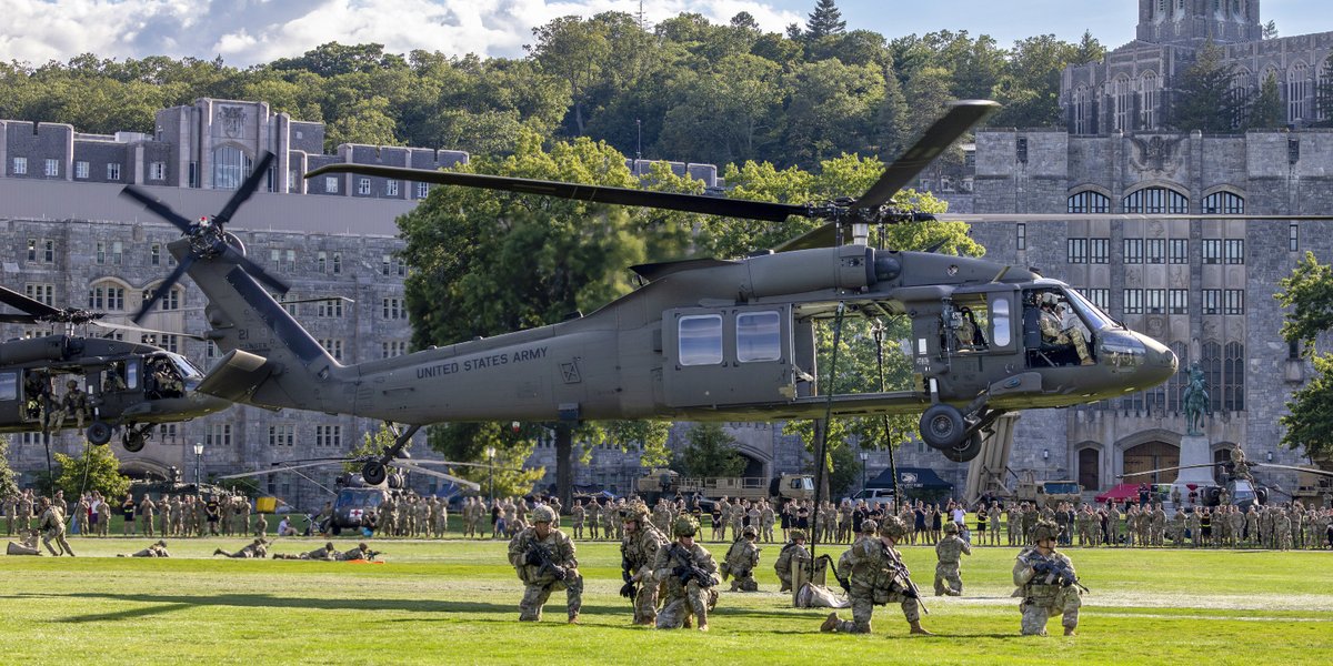 A New York Army National Guard UH-60M Black Hawk helicopter hovers above The Plain at the United States Military Academy at West Point on August 28, 2025 as Soldiers from the 101st Airborne Division (Air Assault) fast rope down to the ground during a capabilities demonstration for cadets.