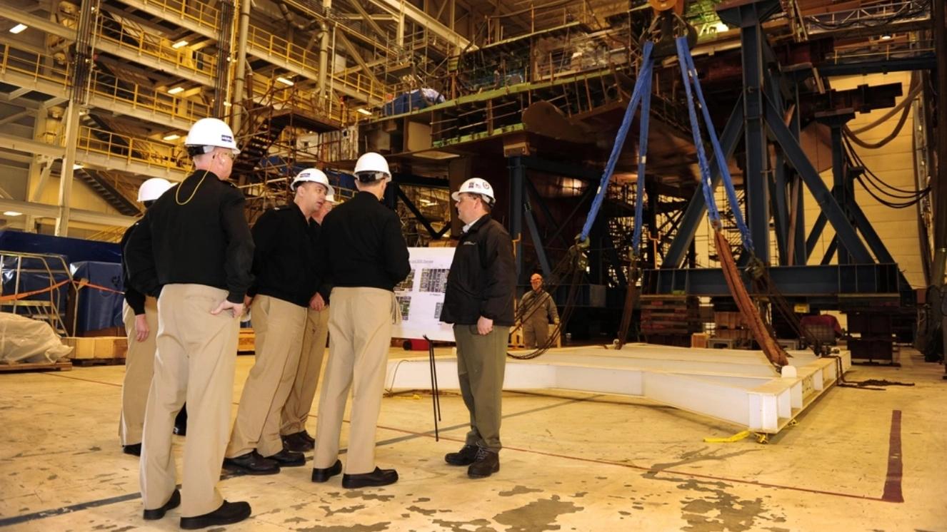 Chief of Naval Operations Adm. Jonathan Greenert tours the Bath Iron Works shipbuilding facility with U.S. Senator Susan Collins to view the progress of the Zumwalt-class guided-missile destroyer, the future USS Zumwalt, talking about US Navy shipbuilding.