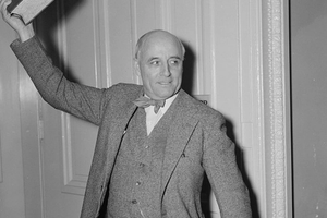 Rep Andrew May holding a book.