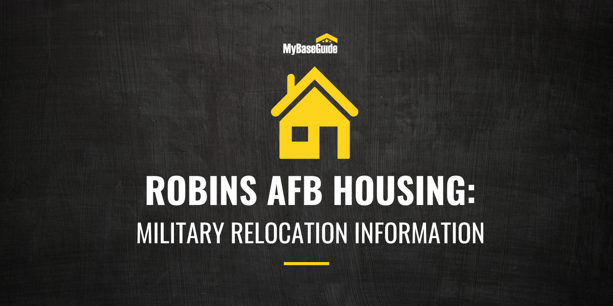 Robins AFB housing guide cover with yellow house icon on blackboard background