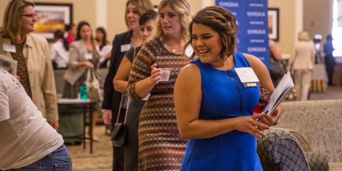 Military spouses networking at MSCAP Fellowship event indoors