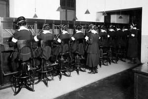 Vintage black & white image of women telephone operators at work.