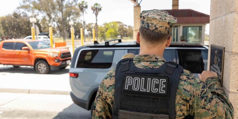 U.S. Immigration and Customs Enforcement agents and U.S. Marine Corps military police officers conduct credential checks in coordination with installation security and access requirements at Marine Corps Base Camp Pendleton, California, May 15, 2025.