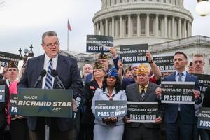 Jon Tester talks to STAR activists in front of the Capitol