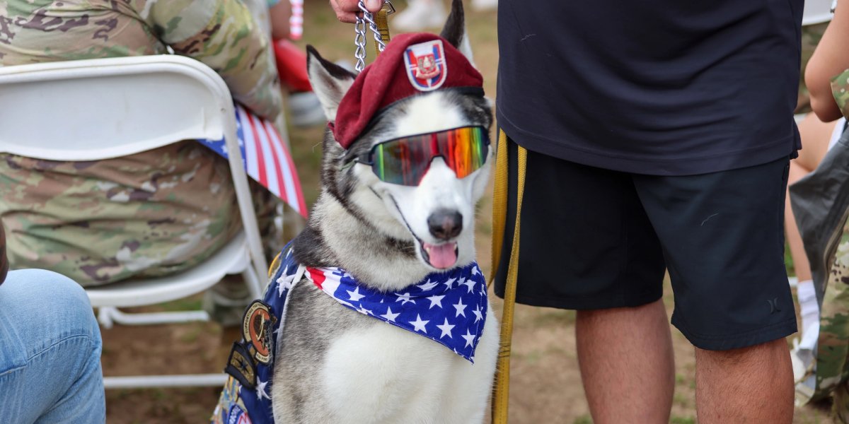 Sapper with flag kerchief, sunglasses, and beret.