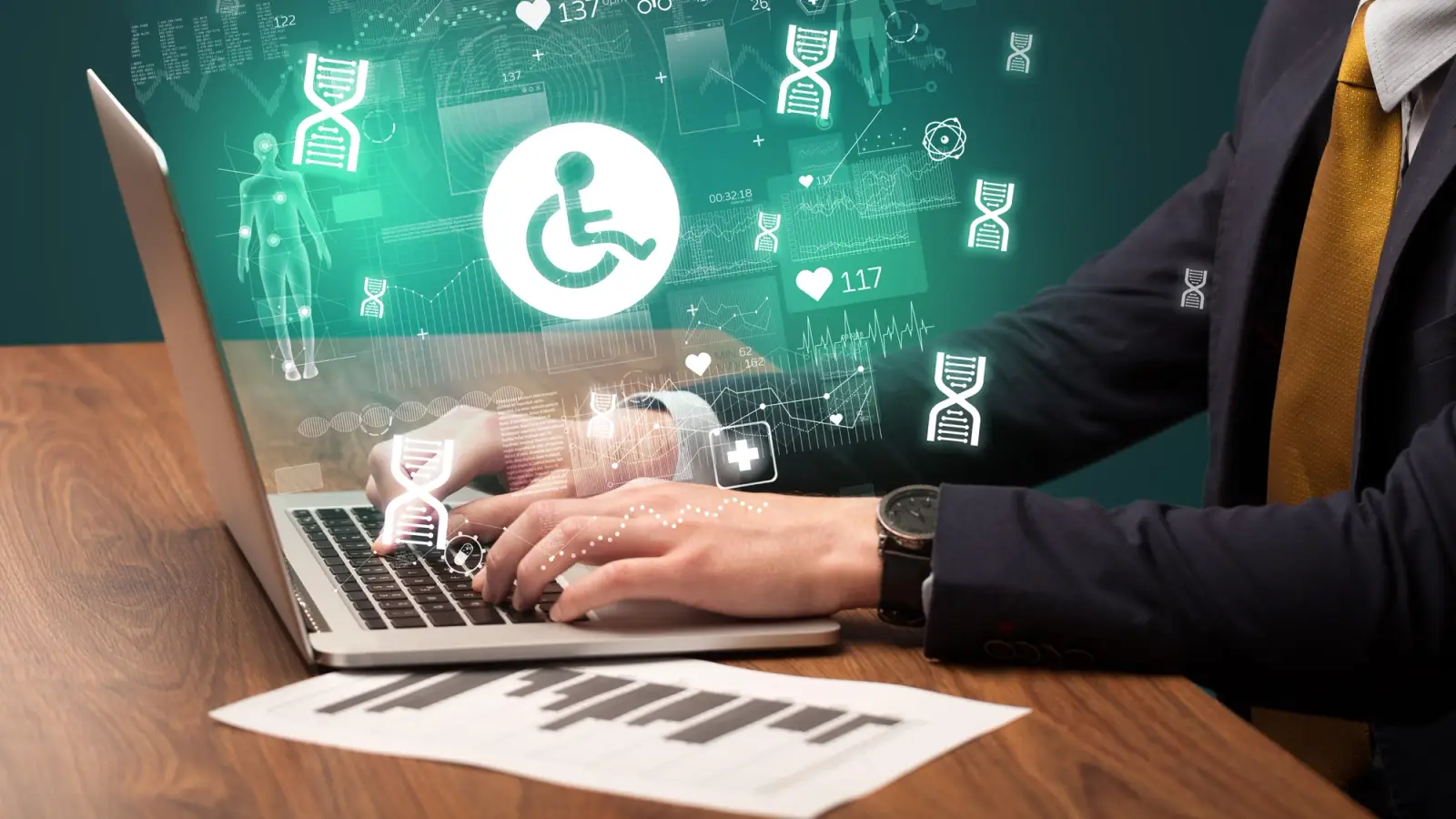 Close-up of a man's hands typing on a laptop, with digital type and disability symbols floating around as an illustration.
