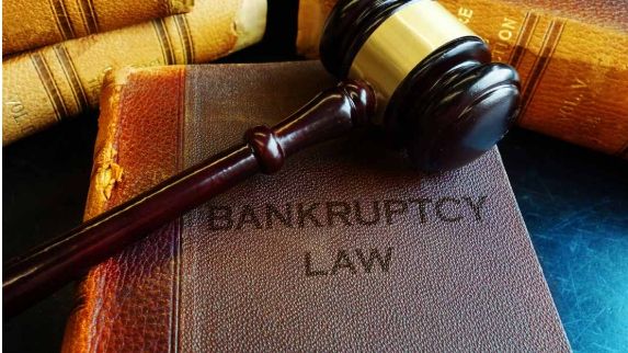 Still life of gavel and book of Bankruptcy Law.