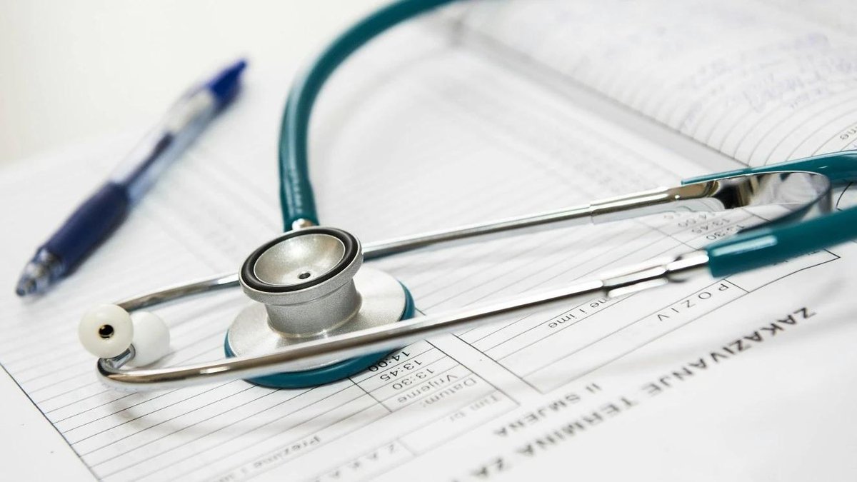 A stethoscope on a patient chart.