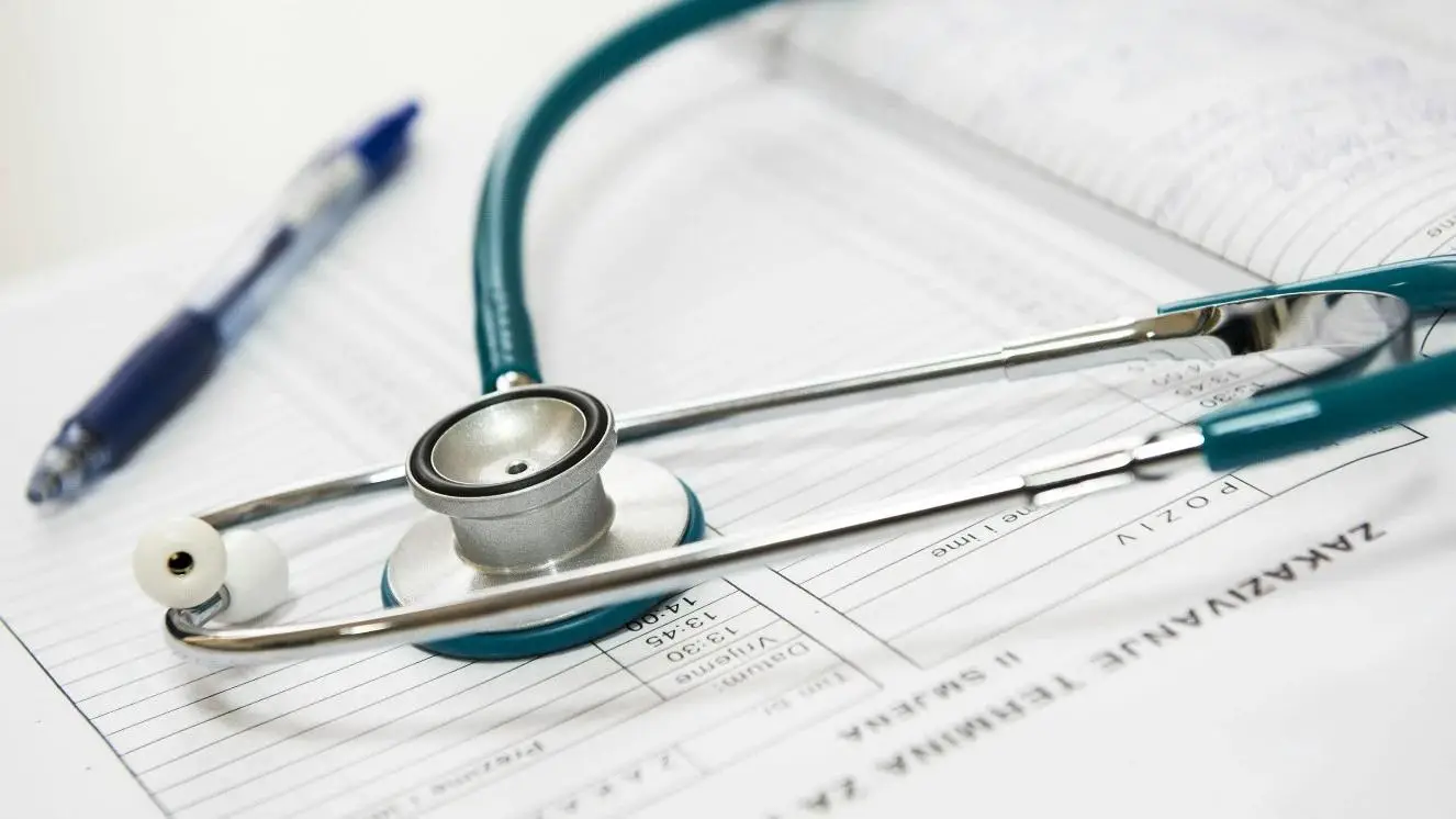 A stethoscope on a patient chart.
