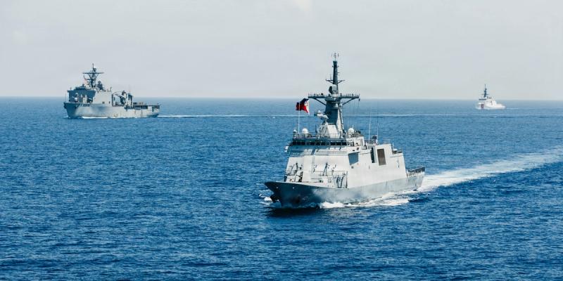 From left, U.S. Navy Whidbey Island-class amphibious dock landing ship USS Ashland (LSD 48), Philippine Navy Miguel Malvar-class guided-missile frigate BRP Miguel Malvar (FFG 6), and U.S. Coast Guard Legend-class cutter USCGC Midgett (WMSL 757) steam in formation during a group sail exercise as part of Exercise Balikatan 2026 in the South China Sea, April 28, 2026.