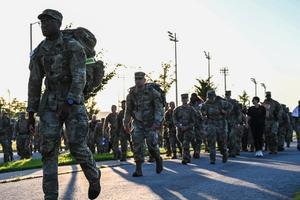Soldiers march in a commemorative ruck for 9/11 remembrance.
