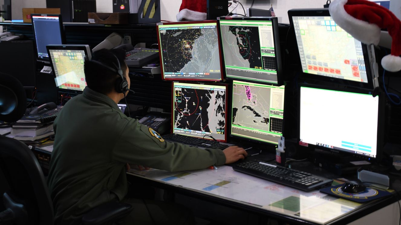 An Air Force Major prepares to track Santa.