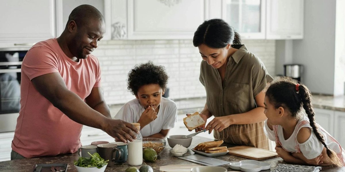 Family preparing a meal together in a kitchen, focusing on easy, stress-free recipes for military members.