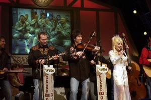 Dolly and her band on stage at the Grand Ole Opry.