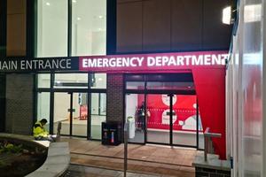 Exterior of a the main entrance and ER of a hospital.