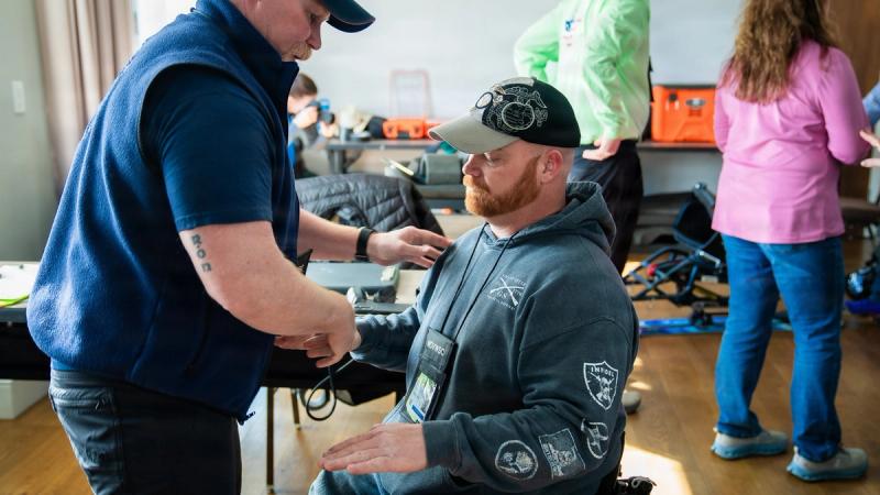 U.S. Marine Corps Veteran Joe Gibson gets fitted for his adaptive ski equipment at the National Disabled Veterans Winter Sports Clinic during the seating, prosthetic limb and boot fitting session at Snowmass Village, Colorado, April 5, 2026. 