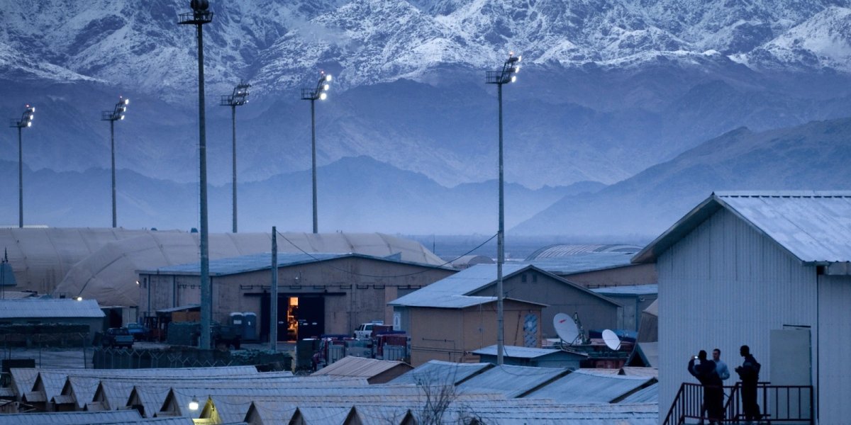 Airmen take a photo opportunity of the surrounding mountains from a staircase at Bagram Air Field, Afghanistan, Dec. 18.