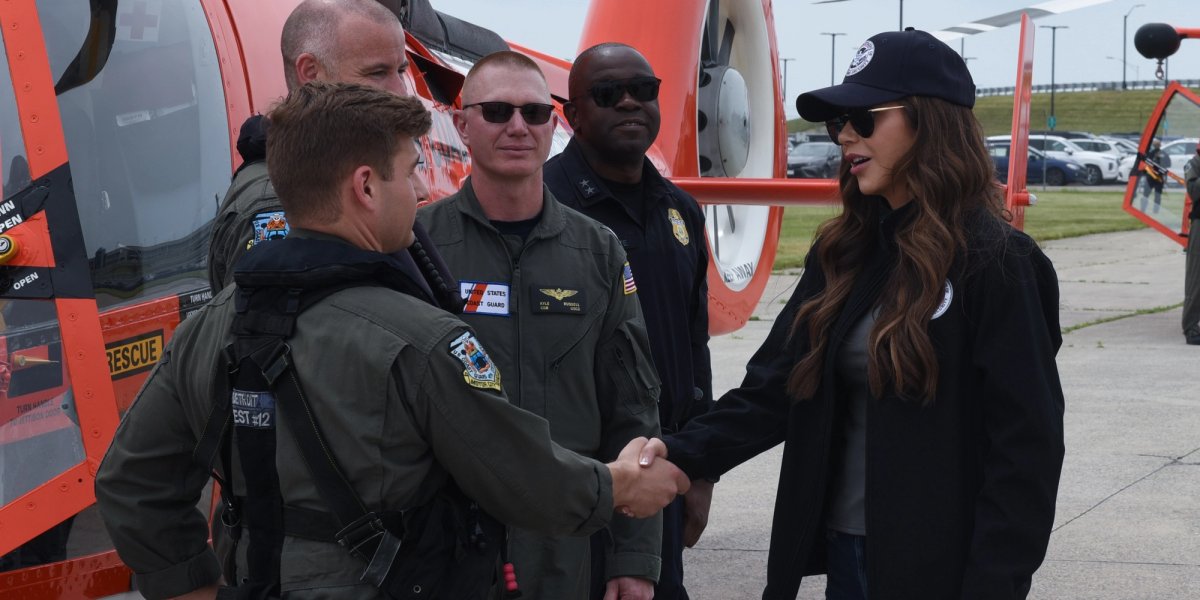 Secretary Noam shakes the hands of Coast Guard members.