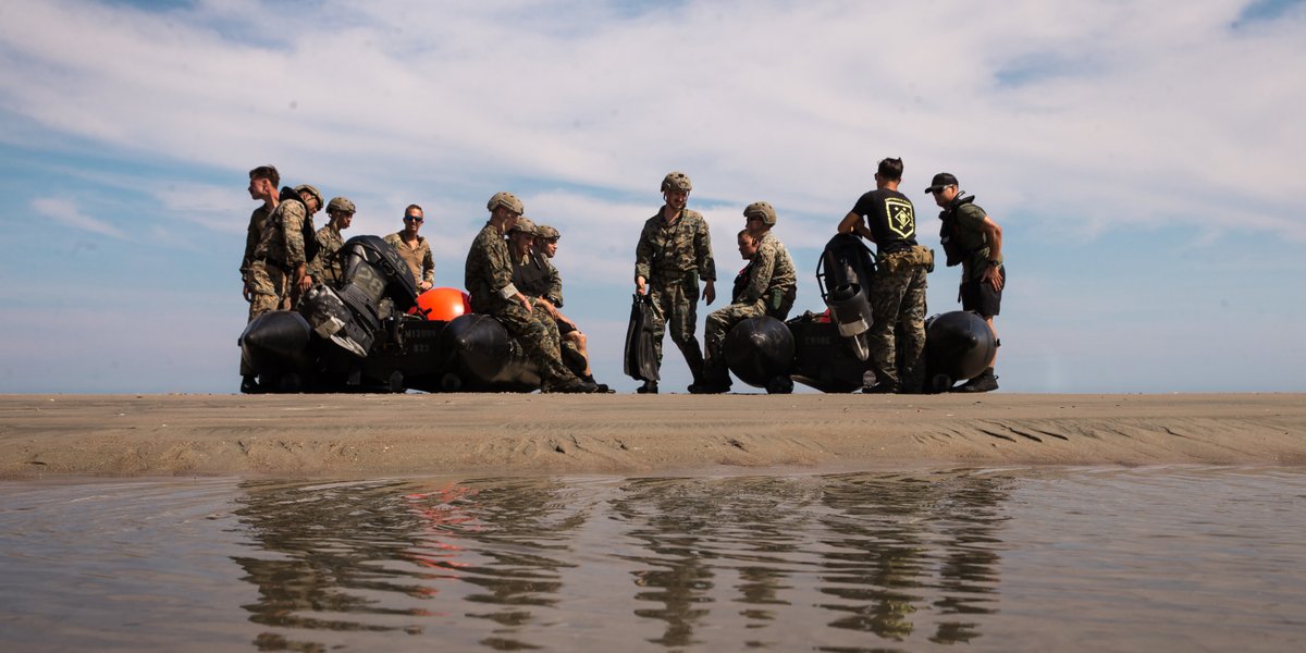 U.S. Marines with Bravo Company, 2d Recconaissance Battalion, 2d Marine Divison, prepare to launch a Combat Rubberized Raiding Craft during an air to sea insertion training event on Camp Lejuene, N.C.