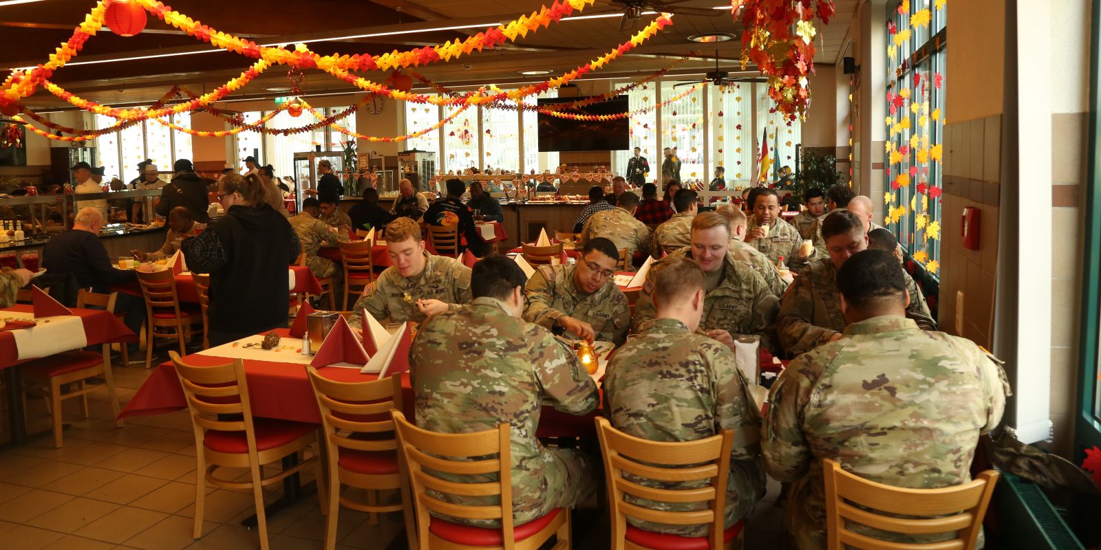 Soldiers and families enjoy a Thanksgiving meal together during the Hohenfels Thanksgiving Luncheon at the dining facility in Hohenfels, Germany, Nov. 26, 2024. (Sgt. Joseph Peake/Army)