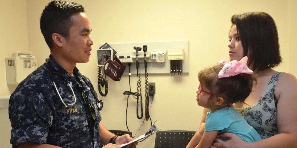 Lt. Gian Han Pham, a physician at Naval Hospital Jacksonville’s Family Medicine Clinic, discusses Rosaelva Granlee’s health during a routine visit.