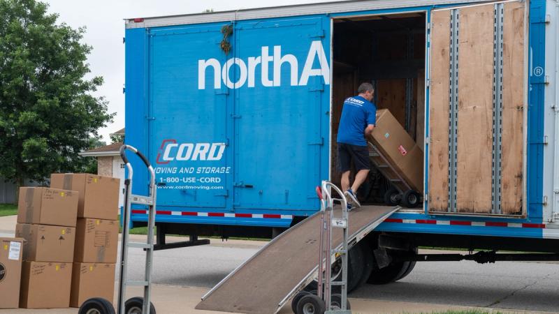 Boxes are loaded onto a moving truck as part of a Permanent Change of Station on Scott Air Force Base, Illinois, July 18, 2025.