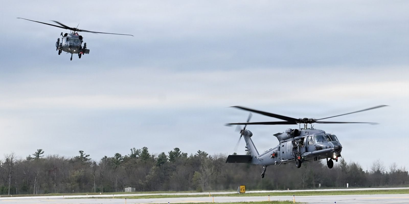 Helicopters taking off for flight.
