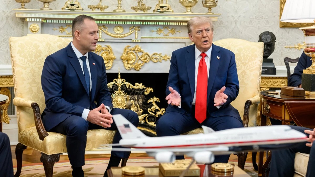 Leader of Poland talks with Pres. Trump in the Oval Office.