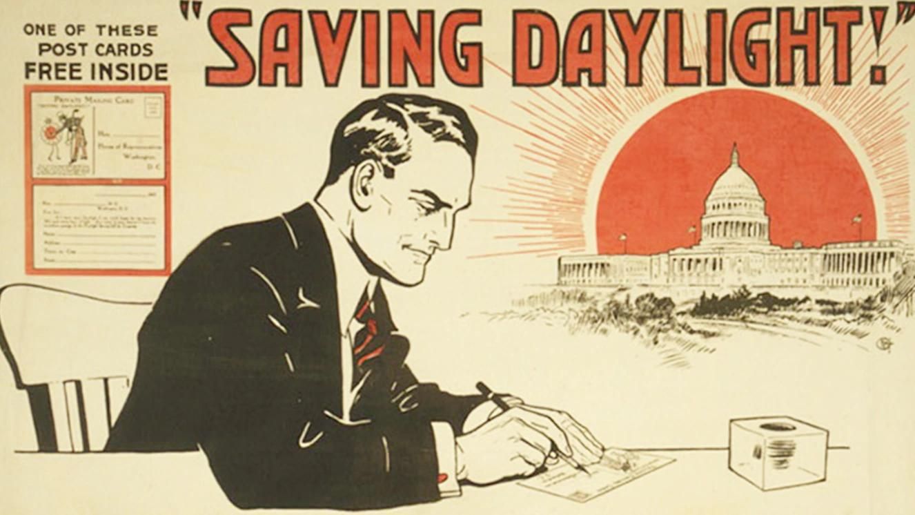 WWI-era poster of man writing, promoting daylight saving with U.S. Capitol and rising sun in background.