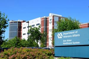 Outside bldg with sign for An Arbor Dept of VA.