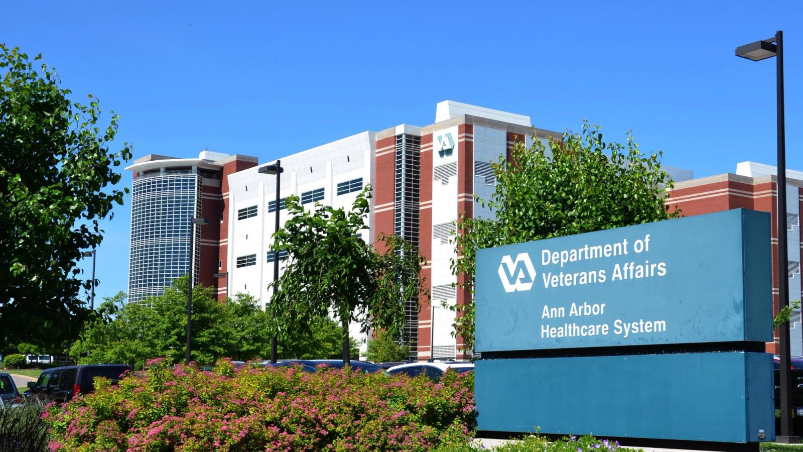 Outside bldg with sign for An Arbor Dept of VA.
