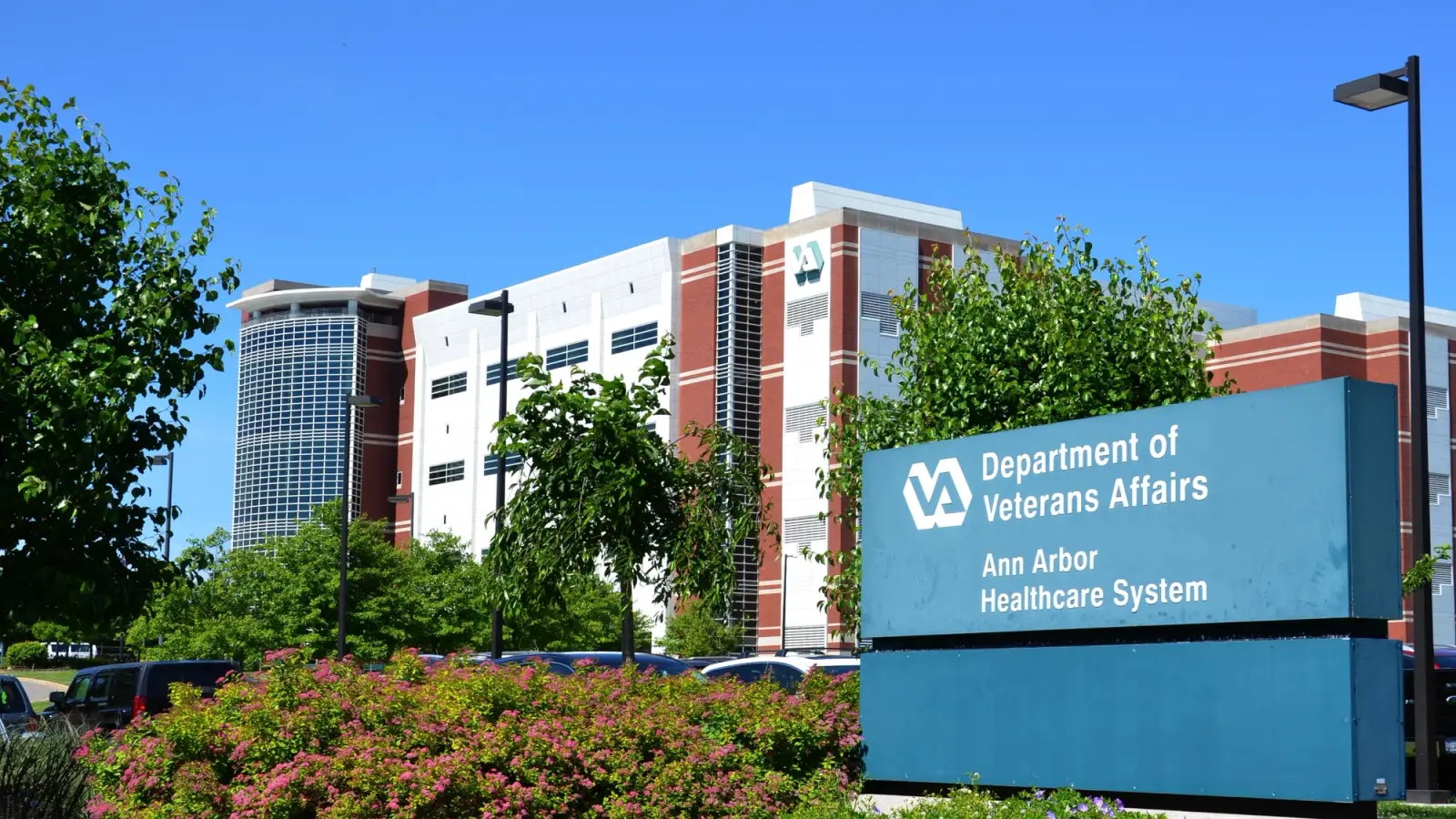 Outside bldg with sign for An Arbor Dept of VA.