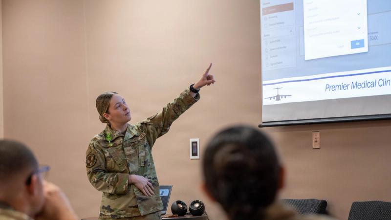 U.S. Air Force Senior Airman Natalia Johnson, 97th Healthcare Operations Squadron referral management supervisor, presents “Travel Reimbursement for Medical Appointments” at Altus Air Force Base, Oklahoma, Dec. 9, 2025.
