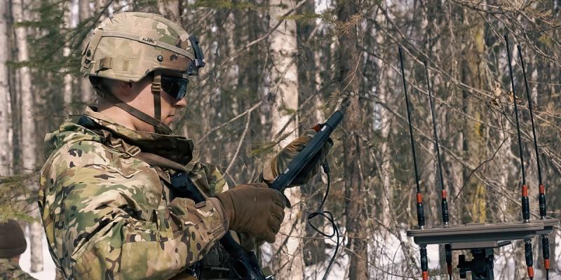 A U.S. Army soldier assigned to the Multi-Functional Reconnaissance Company, 2nd Infantry Brigade Combat Team (Airborne), 11th Airborne Division, sets up his Versatile Radio Observation and Direction system during Operation Arctic Tech at Joint Base Elmendorf-Richardson, Alaska, April 8, 2026.