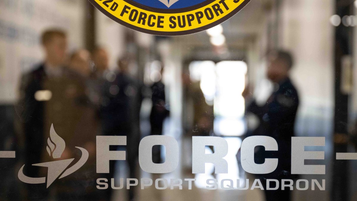 Etched glass sign of Air Force Support squadron office.