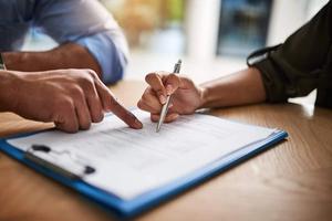 A man looks over a contract.