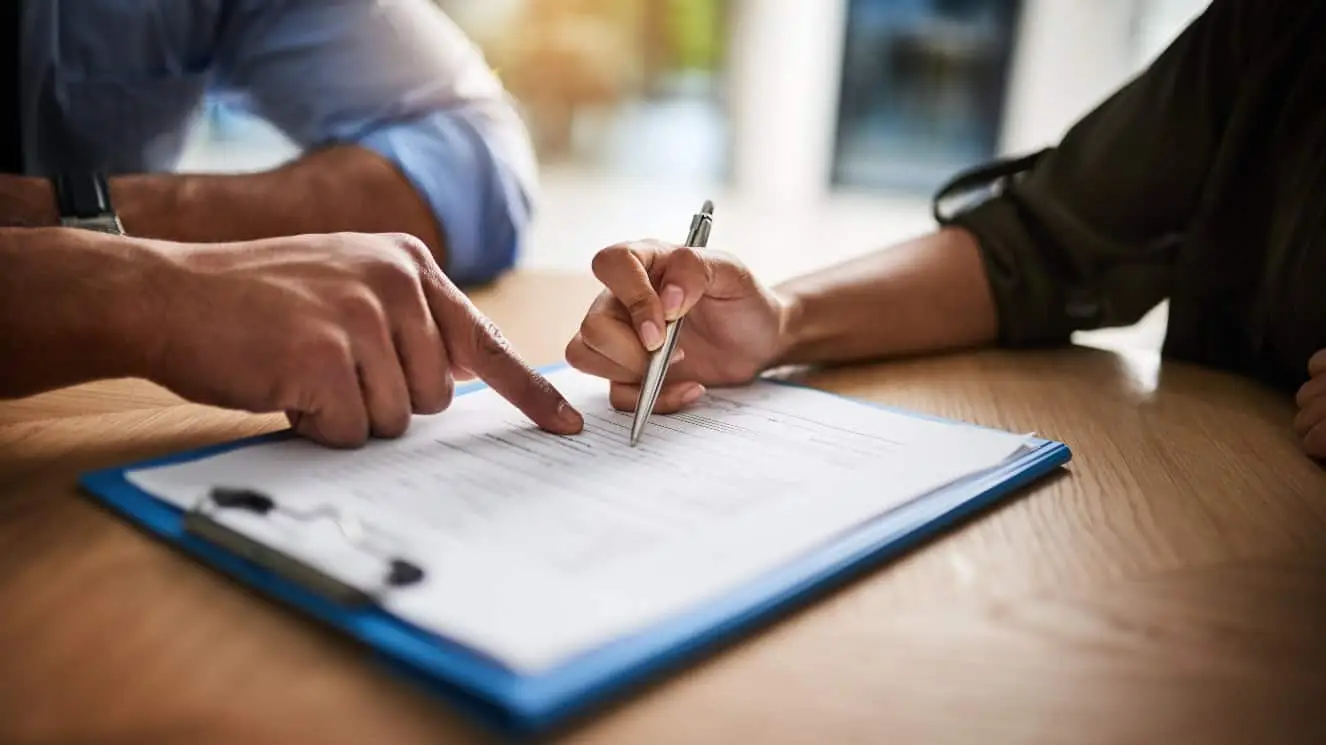 A man looks over a contract.
