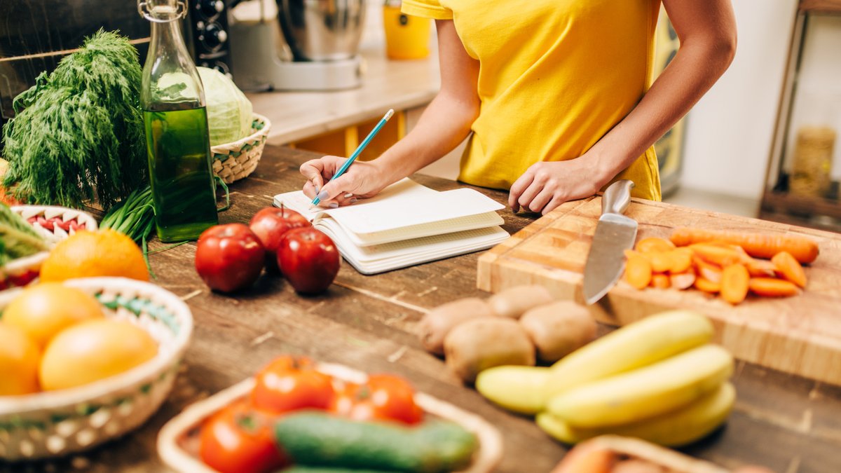 Milspouse cooking a healthy meal in the kitchen.
