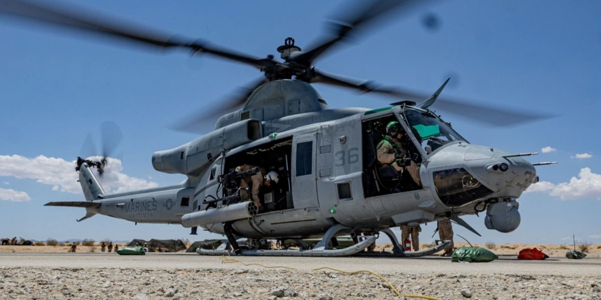 Military helicopter filled with soldiers.