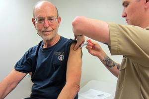 A man gets a shot.