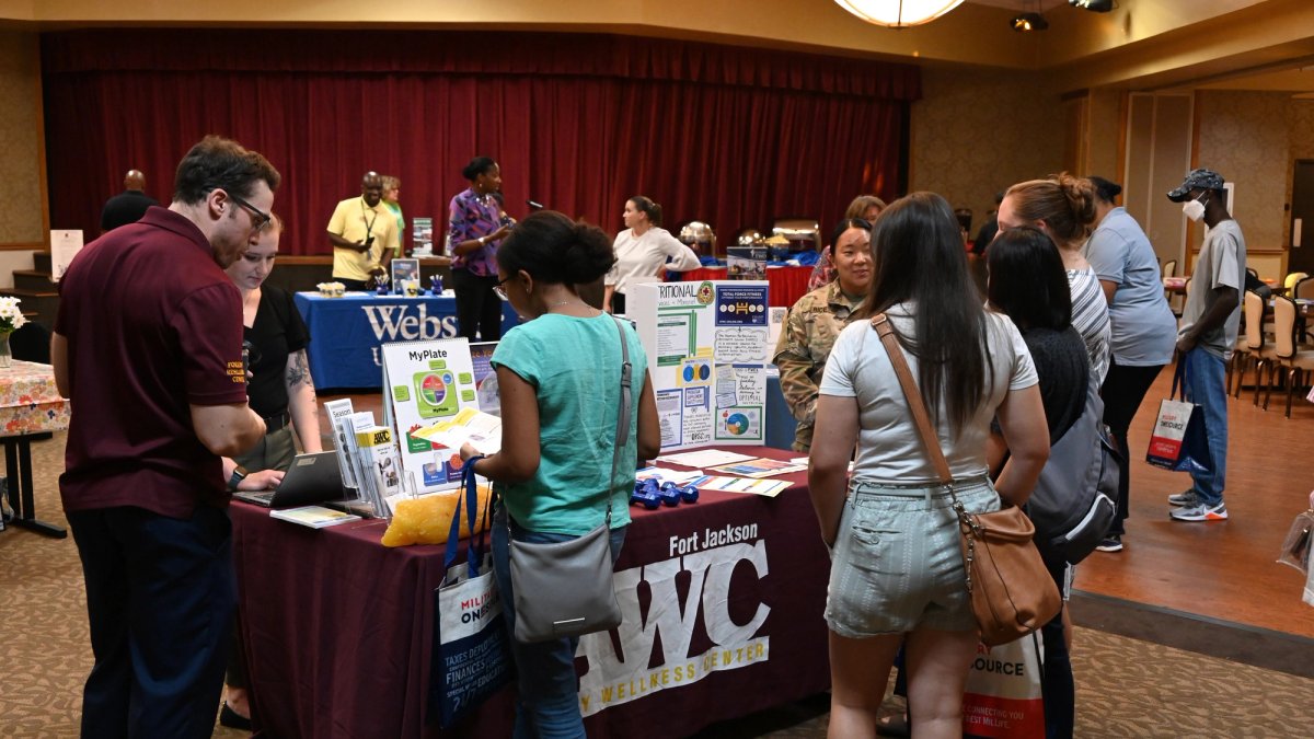 Tables and exhibits at a job fair, close up.