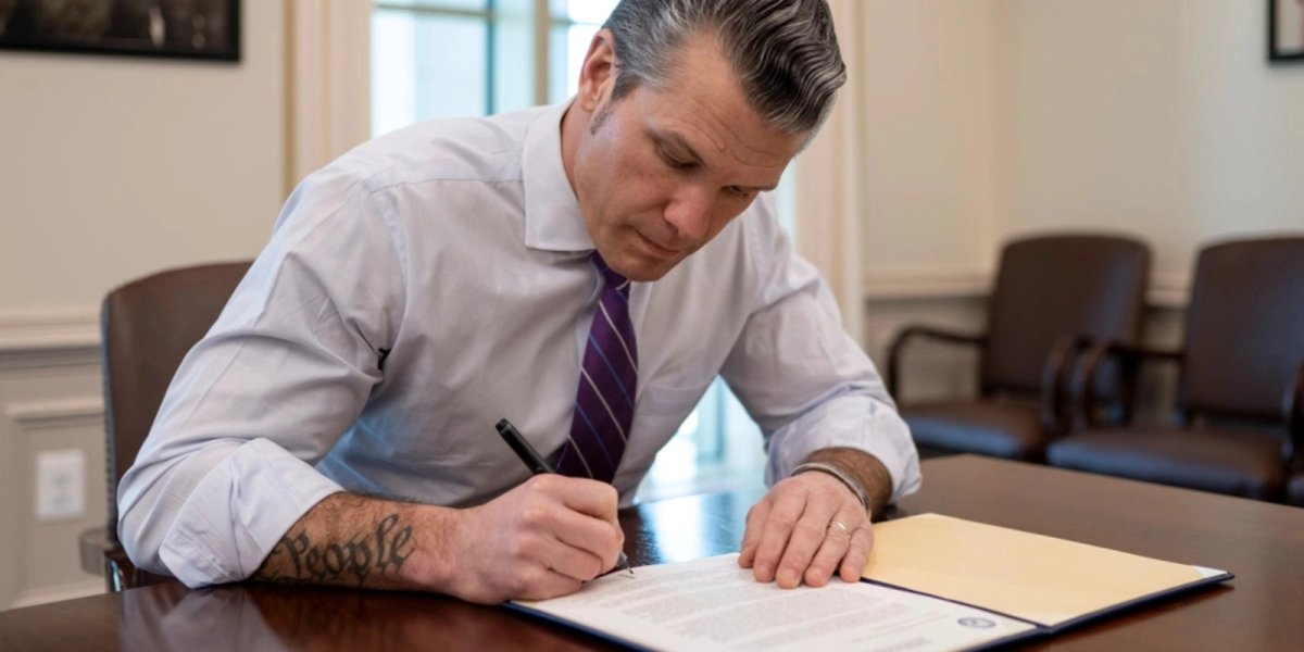 Hegseth signing Fort Moore renaming.