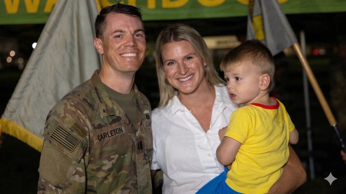 Uniformed soldier with wife and baby.