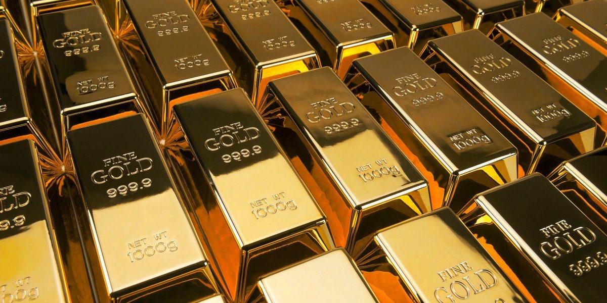 Gold bars stacked next to one another.
