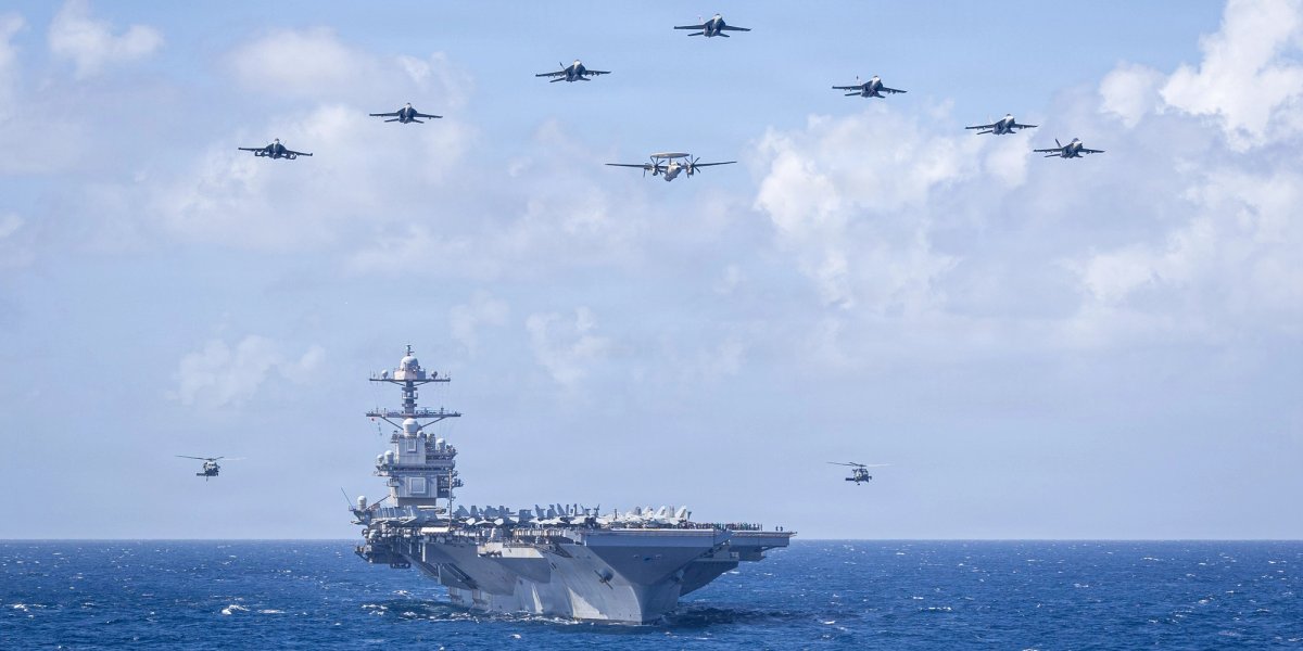 View of jets in formation on the deck of the USS Ford.