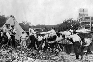 Vintage photo of protestors fighting the police.